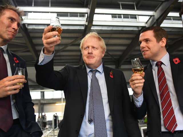Boris Johnson and Douglas Ross are reasons why the Scottish Conservative will lose seats at the Scottish Parliament election, says Angus Robertson (Picture: Stefan Rousseau/PA)