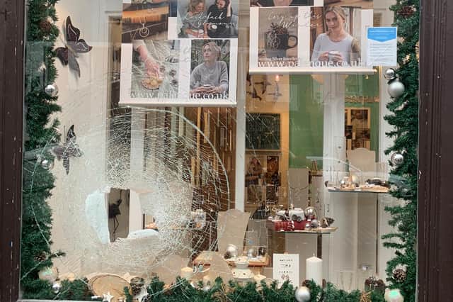 The smashed window of Palenque jewellery shop on the High street, Edinburgh.
