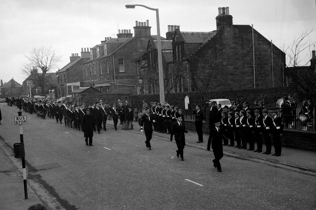 The West District of Edinburgh Battalion Boys Brigade marchin past the Gibson Craig Memorial Hall in Currie in October 1963.