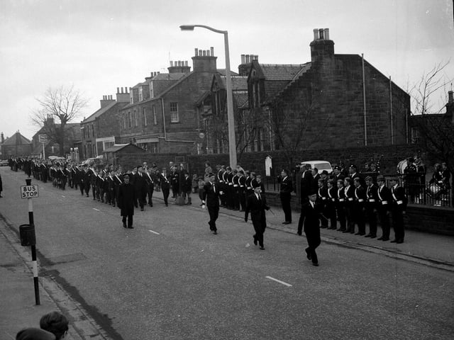 The West District of Edinburgh Battalion Boys Brigade marchin past the Gibson Craig Memorial Hall in Currie in October 1963.