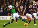 Marvin Bartley challenges former Hearts midfielder Ross Callachan during an Edinburgh derby win for Hibs at Easter Road. Picture: SNS