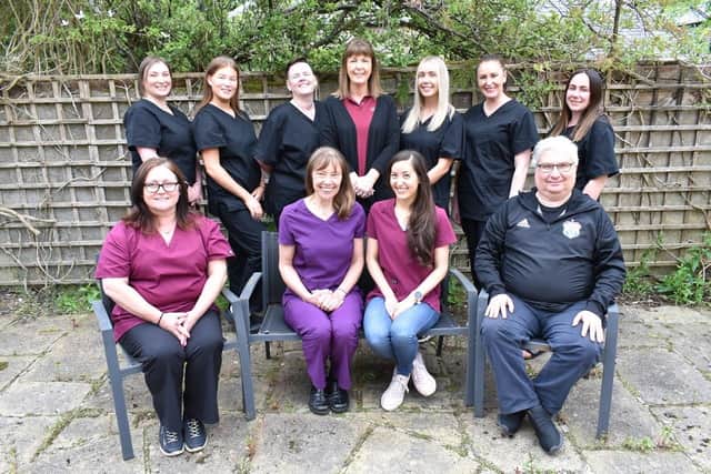 The Magliveras Dental team (Dr Suelynn Tann-Stroud second from right, bottom row).j