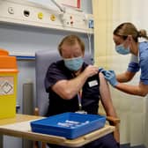 Deputy charge nurse Katie McIntosh administers the first of two Pfizer/BioNTech Covid-19 vaccine jabs to
Clinical Lead of Outpatient Theatres Andrew Mencnarowski, at the Western General Hospital, in Edinburgh. Picture: Andrew Milligan/PA Wire