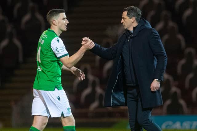 Hibs boss Jack Ross congratulates Paul Hanlon at full-time after a 3-0 win over Motherwell.