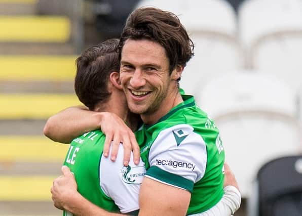 Joe Newell celebrates with Martin Boyle after netting Hibs' second of the game. Picture: SNS