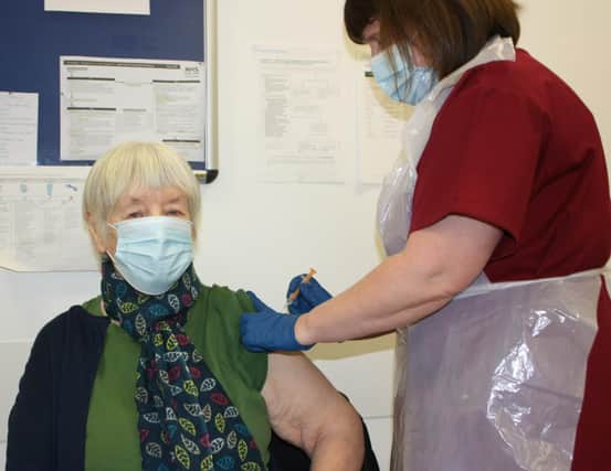 Pauline McHoul, a patient at Riverside Medical Practice, receiving the Covid vaccine from Lead Nurse Diane Fyffe
