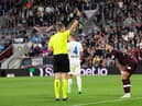 Referee Lawrence Visser shows a red card to Hearts midfielder Jorge Grant against FC Zurich.