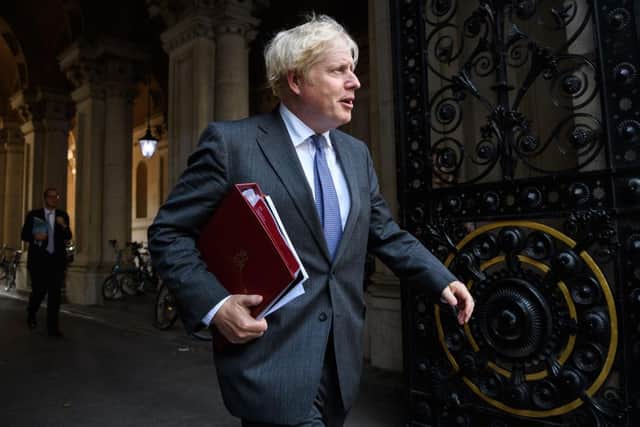 Boris Johnson has warned actions to stop a second surge of coronavirus must be "tough now" in order to "protect" Christmas. (Photo by Leon Neal/Getty Images)