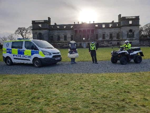 Penicuik Community Officers, Constables Keith Dolan and Julie Hand (on quad), with SPARCI the sheep.