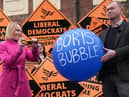 Helen Morgan, winner of the North Shropshire by-election after overturning a Conservative majority of nearly 23,000, symbolically bursts Boris Johnson's 'bubble'