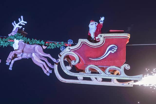 Santa flies through the air, this time without crashing (Picture: Uli Deck/DPA/AFP via Getty Images)