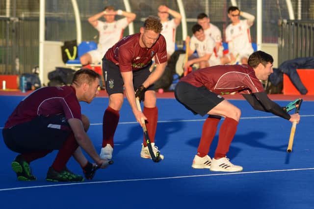 Dan Coultas, second from right, checks his position ahead of a penalty corner for Watsonians at Peffermill. Picture: Nigel Duncan