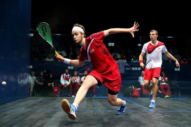 James Willstrop plays a shot against Nick Matthew in the men's singles final at the 2014 Commonwealth Games in Glasgow