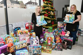 Ellie McIntosh, junior hairdresser and Leah Bella, owner of Leah Bella salon with toys and gifts for Sick Kids in Edinburgh and Cash for Kids appeal