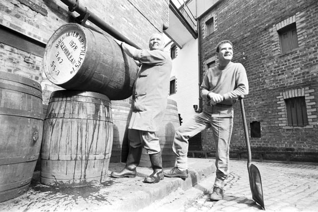 Employees Bill Edmund (with barrel) and Grahame Wood preparing to open Edinburgh's Caledonian Brewery doors to the public during Brewery Month, September 1992.