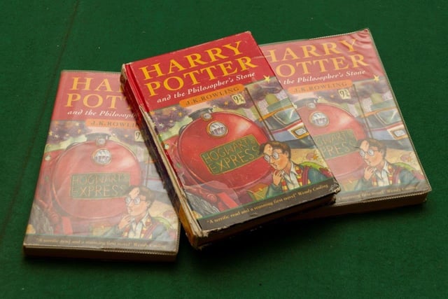 Undated handout photo issued by Hansons auctioneers of three first editions of Harry Potter and The Philosopher's Stone, including a rare hardback, rescued from a school's skip that are going up for auction on May 21, when they are expected to fetch thousands.