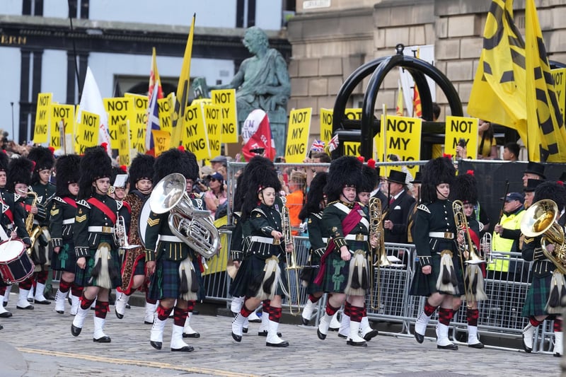 Republican protesters made their presence felt with chants of "Not my king" as the Combined Cadet Force Pipes and Drums and the Cadet Military Band proceed down the Royal Mile.
