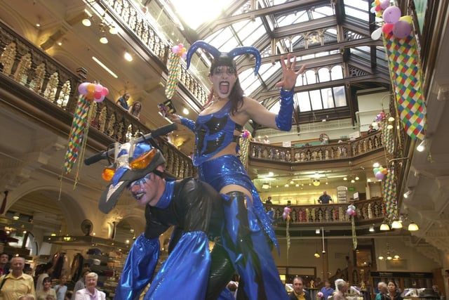 Members of Swamp Circus from Sheffield perform in the main hall in the famous Jenners store on Princes Street as part of the Edinburgh festival in 2000.