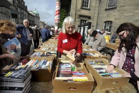 Book buyers browse some of the many volumes on offer at the book sale which has a vast range inside and out.  Photo: Colin Hattersley.