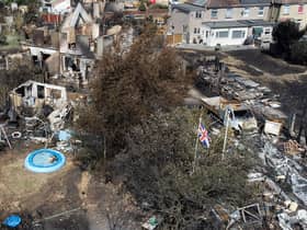 An aerial view shows a Union Flag flying among the the rubble and destruction in a residential area, following a large blaze the previous day in Wennington, Greater London. Picture: Leon Neal/Getty Images