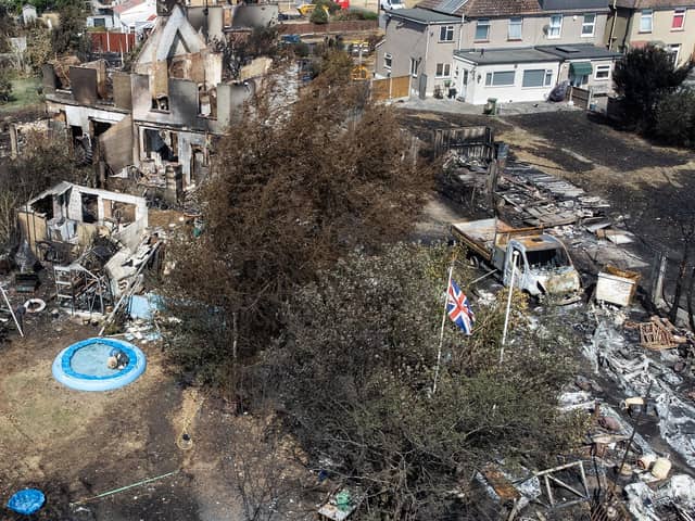 An aerial view shows a Union Flag flying among the the rubble and destruction in a residential area, following a large blaze the previous day in Wennington, Greater London. Picture: Leon Neal/Getty Images