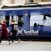 Passengers board a ScotRail train at Glasgow Central Station