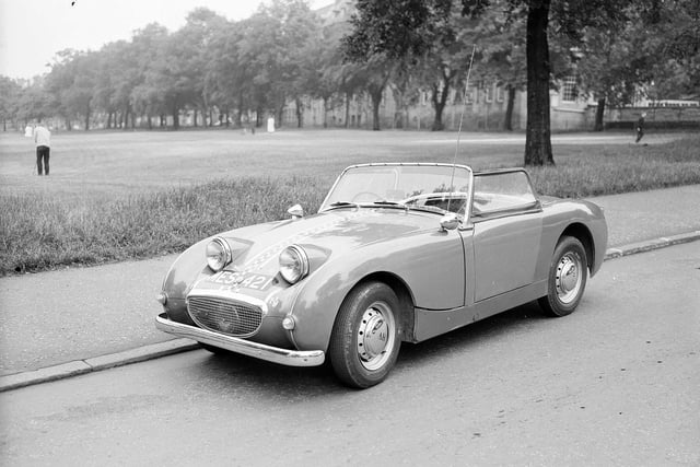 An Austin Healy Sprite on Whitehouse Loan, beside Bruntsfield Links. James Gillespie's High School can be seen in the background. This picture was taken in July 1962.