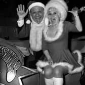 Carry On stars Sid James and Barbara Windsor welcoming guests to a party for ITV's Christmas performers at the New London Theatre.