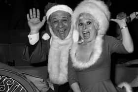 Carry On stars Sid James and Barbara Windsor welcoming guests to a party for ITV's Christmas performers at the New London Theatre.