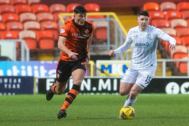 Lewis Neilson in action for Dundee United against Hibs striker Kevin Nisbet last season.