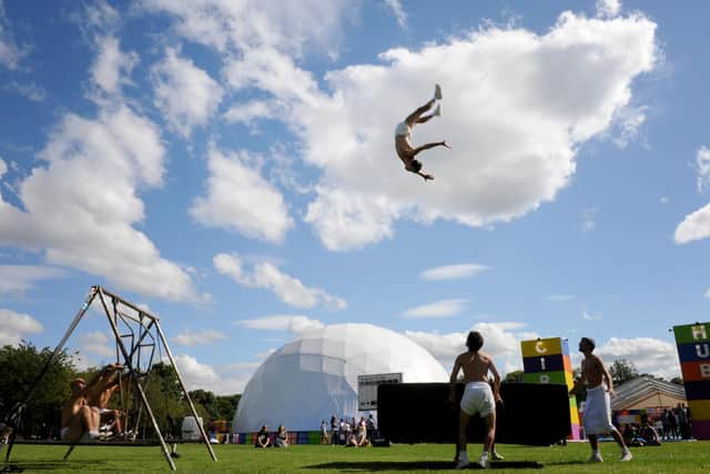 An acrobat from La Meute flies over the Circus Hub, the much-loved Fringe venue in the Meadows. Picture: Jane Barlow