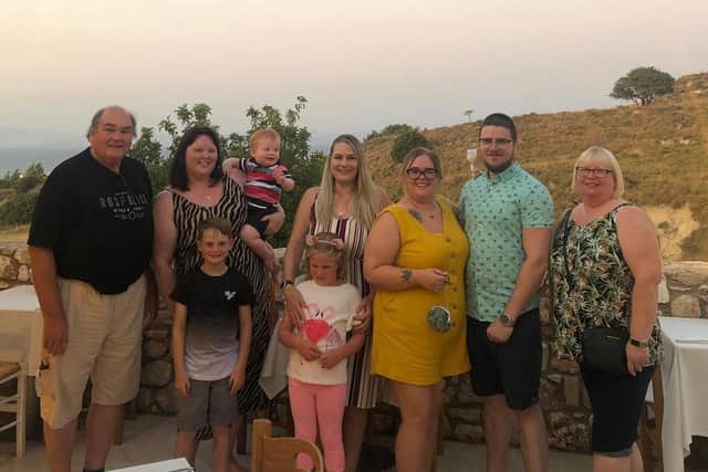 Father-of-three Ian Robertson on holiday with family in Kos, Greece, shortly before the accident.