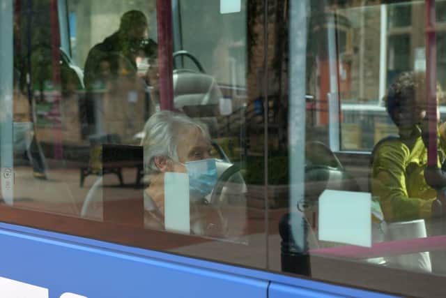 Bus capacity will remain half of normal levels even with passenger distancing cut to 1 metre. Picture: Michael Gillen.