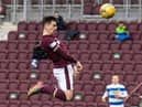 Jamie Walker rises high to recuse Hearts a point. Picture: SNS