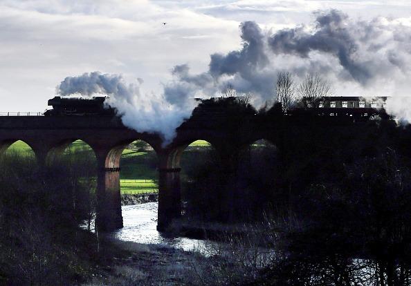 The Flying Scotsman crosses a viaduct during a test run along the East Lancashire line for the first time in ten years on January 8, 2016 in Bury, England.  The Flying Scotsman is being run under steam since undergoing a £4.2m decade-long restoration. The legendary locomotive has been brought back to life so it can be exhibited at the National Railway Museum in York.