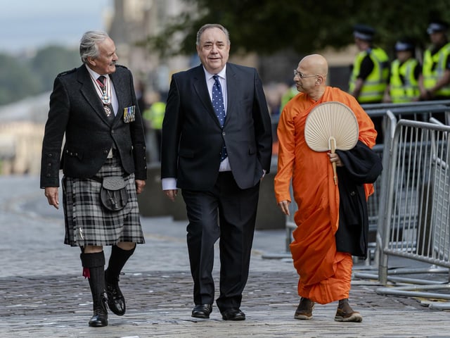 Former First Minister Alex Salmond (right) arrives at St Giles' Cathedral, Edinburgh for a Service of Prayer and Reflection for Queen Elizabeth II.