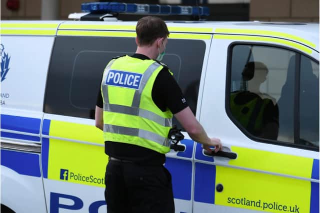A Police Scotland officer outside his van picture: JPI Media