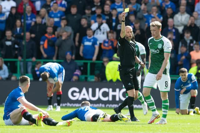 Doyle-Hayes is booked for his challenge on John Lundstram during the 2-2 draw between Hibs and Rangers