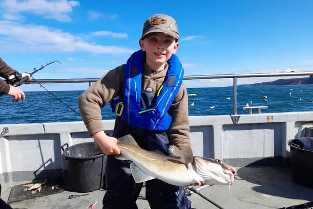 Eight-year-old Leon Deacons with his 5lb cod caught off Eyemouth with Aquamarine Charters. Picture: Aquamarine Charters