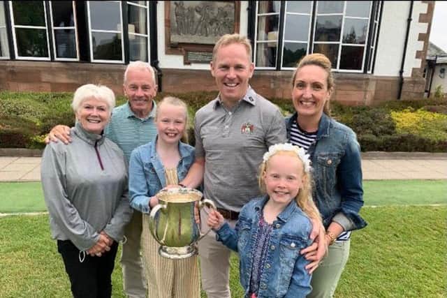 David Miller celebrates with his family after winning the Royal Burgess championship for the first time