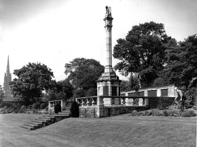 The head gardener tending flowers bordering the George Heriot's School War Memorial, subscribed to by former pupils and relatives of the dead of the two Great Wars, in July 1959.