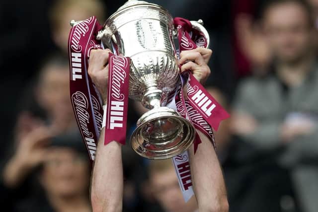 Ryan McGowan lifts the Scottish Cup after the 5-1 victory over Hibs in the 2012 final