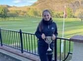 Broomieknowe's Megan Fallon shows off the trophy after winning the Midlothian Junior Championship at Prestonfield. Picture: MCLGA