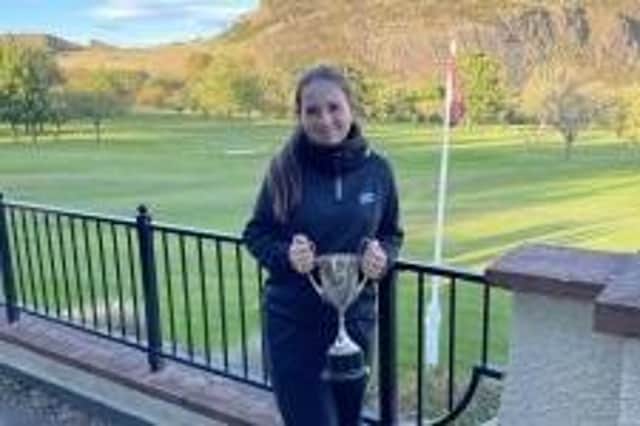 Broomieknowe's Megan Fallon shows off the trophy after winning the Midlothian Junior Championship at Prestonfield. Picture: MCLGA