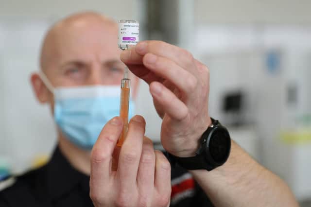 A dose of the Oxford/AstraZeneca coronavirus vaccine is prepared for use (Picture: Andrew Matthews/WPA pool/Getty Images)