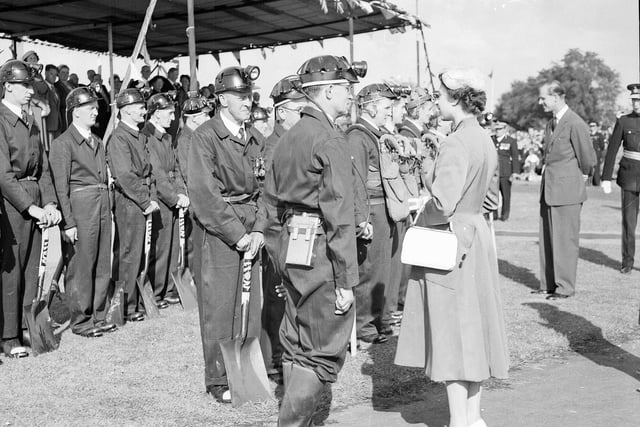 The Queen Elizabeth meets members of Mines Rescue from various local collieries in Tranent during her tour of Scotland in July 1956.