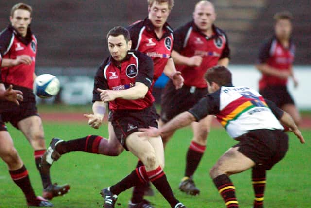 Gareth Baber (9), in action for Newport Gwent Dragons against Edinburgh at Meadowbank in 2004. Baber is poised to tackle Derrick Lee. Current Edinburgh coach Mike Blair is on the left of the picture.