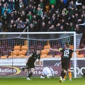 Kevin Nisbet celebrates in front of the jubilant Hibs support after putting the club 1-0 up in Sunday's win over Motherwell. Picture: SNS