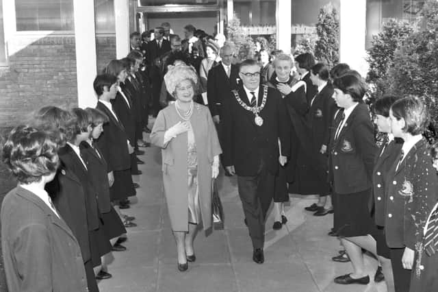 Lord Provost Herbert Brechin introduces the Queen Mother to some of the girls at James Gillespie's High School during her visit in October 1966.