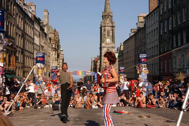 Street artists perform on the Royal Mile during the Fringe festival (Picture: Ian Stewart/AFP via Getty Images)